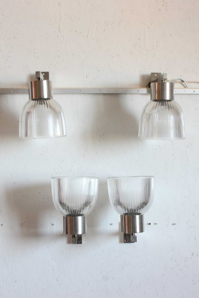 Pair of 1104 model wall lamps designed by Tito Agnoli for Oluce.