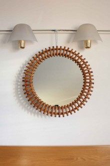 Round bamboo wall mirror in the style of Olaf Von Bohr
