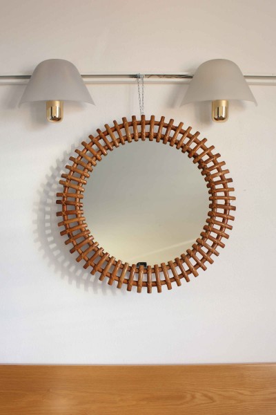 Round bamboo wall mirror in the style of Olaf Von Bohr