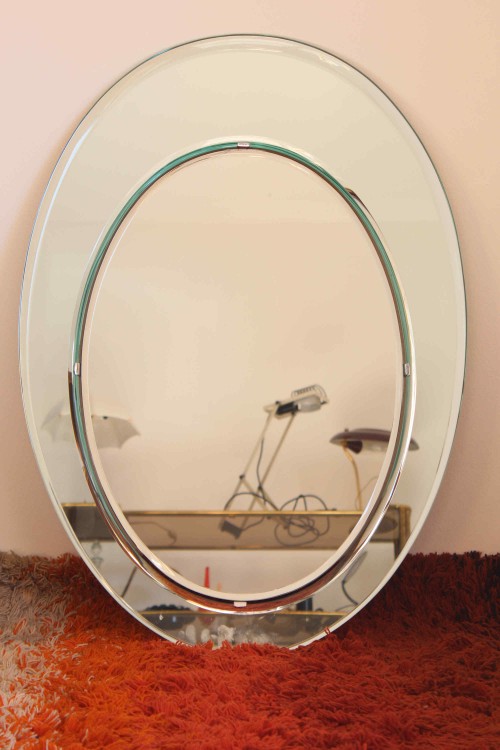 Oval mirror in cut glass produced by...