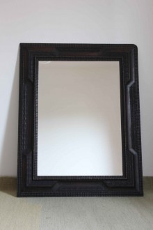 Mirror with ebonized wood frame, guilloché detail